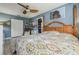 Bright bedroom with ceiling fan, large closet, and a relaxing atmosphere at 10962 Sw 80 Ct, Ocala, FL 34481