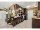 Modern kitchen with dark wood cabinets and tile backsplash at 10962 Sw 80 Ct, Ocala, FL 34481