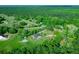 Aerial view of a house and surrounding land at 11540 Se Highway 464, Ocklawaha, FL 32179