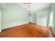 Bright bedroom featuring wood floors and a view at 11540 Se Highway 464, Ocklawaha, FL 32179