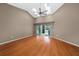 Living room with laminate floors and sliding doors to patio at 11540 Se Highway 464, Ocklawaha, FL 32179