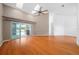 Living room with laminate floors and sliding doors to patio at 11540 Se Highway 464, Ocklawaha, FL 32179