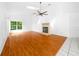 Living room with laminate wood floors and fireplace at 11540 Se Highway 464, Ocklawaha, FL 32179