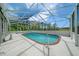 Inviting screened-in pool area with brick coping and ample space at 11540 Se Highway 464, Ocklawaha, FL 32179