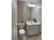 Clean bathroom with single sink vanity and shower/tub combo at 11557 Sw 75Th Cir, Ocala, FL 34476