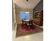 Dining area with a wood table, chairs, and a statement rug at 11557 Sw 75Th Cir, Ocala, FL 34476