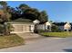 Houses with green roofing, lush landscaping and paved road at 11557 Sw 75Th Cir, Ocala, FL 34476