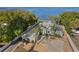 Aerial view of waterfront house with landscaping at 13041 Se 158Th Ln, Weirsdale, FL 32195