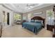 Spacious bedroom with a king-size bed and plenty of natural light at 13041 Se 158Th Ln, Weirsdale, FL 32195