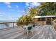 Lakefront deck with seating for relaxing at 13041 Se 158Th Ln, Weirsdale, FL 32195