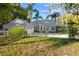 House exterior with orange trees and palm trees at 13041 Se 158Th Ln, Weirsdale, FL 32195