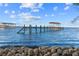 Serene lake view with a wooden pier at 13041 Se 158Th Ln, Weirsdale, FL 32195