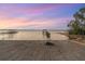 Private waterfront access with sandy beach and dock at 13041 Se 158Th Ln, Weirsdale, FL 32195