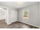 Bedroom with double door closet and wood-look floors at 13183 Sw 113Th Place, Dunnellon, FL 34432