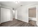 Spacious bedroom with double doors closet and grey vinyl flooring at 13183 Sw 113Th Place, Dunnellon, FL 34432