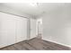 Bedroom with double door closet and wood-look floors at 13183 Sw 113Th Place, Dunnellon, FL 34432