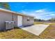 Single story home with AC unit and side patio at 13183 Sw 113Th Place, Dunnellon, FL 34432