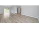 Open living space featuring vinyl plank flooring and access to backyard at 14175 Sw 30Th Street Rd, Ocala, FL 34481