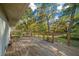 Wooden deck overlooking the backyard and trees at 14221 Ne 47Th Ave, Anthony, FL 32617