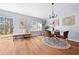 Dining area with hardwood floors and modern chandelier at 14221 Ne 47Th Ave, Anthony, FL 32617