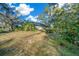 Gray house exterior with deck and lush landscaping at 14221 Ne 47Th Ave, Anthony, FL 32617