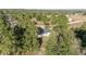 Aerial view of a home on a wooded lot at 15002 Sw 27 St, Ocala, FL 34481