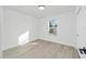 Well-lit bedroom with vinyl flooring and a window at 15002 Sw 27 St, Ocala, FL 34481