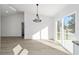 Bright dining area with a chandelier and sliding glass doors at 15002 Sw 27 St, Ocala, FL 34481