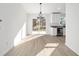 Sunlit dining area with vinyl flooring and sliding glass doors at 15002 Sw 27 St, Ocala, FL 34481