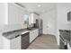 Modern kitchen featuring white cabinets and granite countertops at 15002 Sw 27 St, Ocala, FL 34481