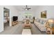 Bright living room with light colored couch and wood coffee table at 15002 Sw 27 St, Ocala, FL 34481