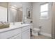 Modern bathroom with white vanity and tile flooring at 15570 Sw 51St Terrace Rd, Ocala, FL 34473