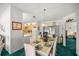 Formal dining room with chandelier and view into adjacent kitchen at 17380 Se 98Th Cir, Summerfield, FL 34491