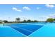 Blue tennis courts in a community setting at 17890 Se 96Th Ct, Summerfield, FL 34491