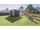 Backyard with shed and firepit seating area at 20 Fir Dr, Ocala, FL 34472