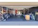 Home gym in garage with flooring, equipment, and storage at 20 Fir Dr, Ocala, FL 34472