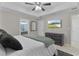 Main bedroom with ensuite bathroom and ceiling fan at 20 Fir Dr, Ocala, FL 34472