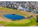 Aerial view of homes, pond, and golf course at 2045 Nw 56Th Ter, Ocala, FL 34482