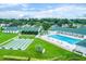 Aerial view of community features including pool, shuffleboard, and clubhouse at 2045 Nw 56Th Ter, Ocala, FL 34482