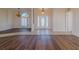 Bright and airy entrance hall with tiled flooring and a view into the dining room at 2045 Nw 56Th Ter, Ocala, FL 34482