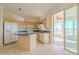 Kitchen with light wood cabinets, blue countertops, and island at 2045 Nw 56Th Ter, Ocala, FL 34482