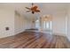 Living room with wood-look floors and access to the sunroom and dining room at 2045 Nw 56Th Ter, Ocala, FL 34482