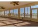 Sunroom with large windows, carpet, and ceiling fans at 2045 Nw 56Th Ter, Ocala, FL 34482