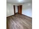 Spacious bedroom with wood-look flooring and closet at 2191 Ne 40Th St, Ocala, FL 34482