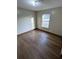 Bright bedroom with wood-look flooring at 2191 Ne 40Th St, Ocala, FL 34482