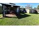 Backyard with gazebo, deck, and grassy lawn at 2241 Brian Ave, South Daytona, FL 32119