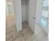 Clean hallway with tile floors and storage closet at 2241 Brian Ave, South Daytona, FL 32119