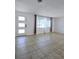 Living room with tile floors and modern front door at 2241 Brian Ave, South Daytona, FL 32119