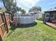 Above-ground pool with wooden deck and ladder at 2241 Brian Ave, South Daytona, FL 32119