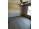 Spacious bedroom with ceiling fan and window at 22564 Sw Rainbow Lakes Blvd, Dunnellon, FL 34431